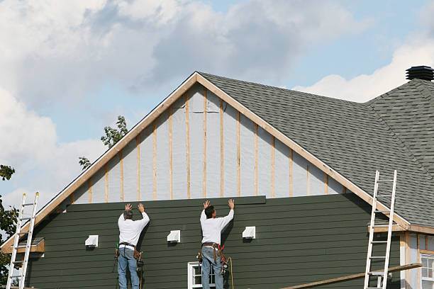 Professional Siding Installation technician working in Mattapan, MA